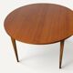 Round extendable dining table in teak – 1960s