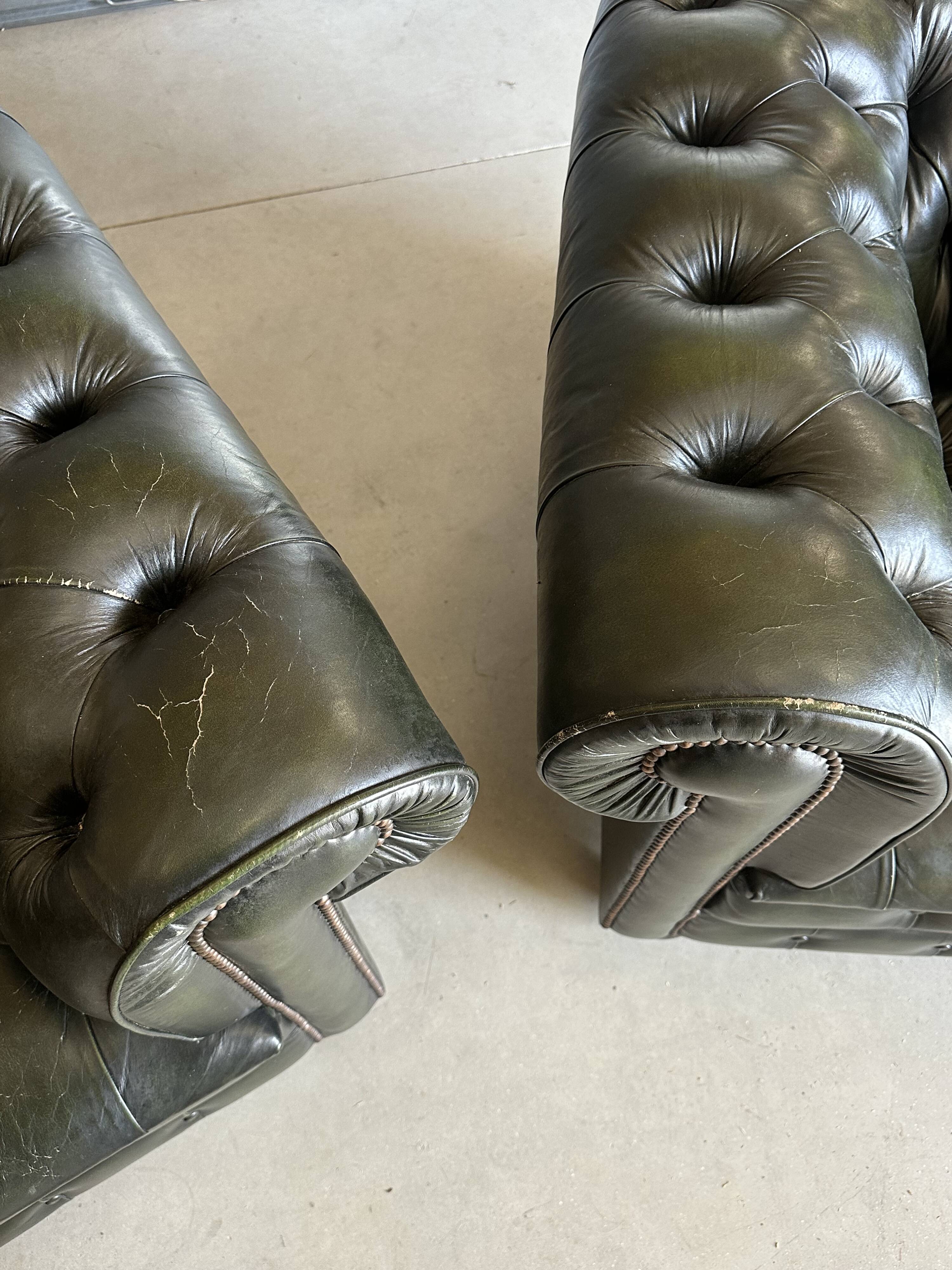 Title: Pair of vintage olive green leather Chesterfield armchairs