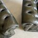 Title: Pair of vintage olive green leather Chesterfield armchairs