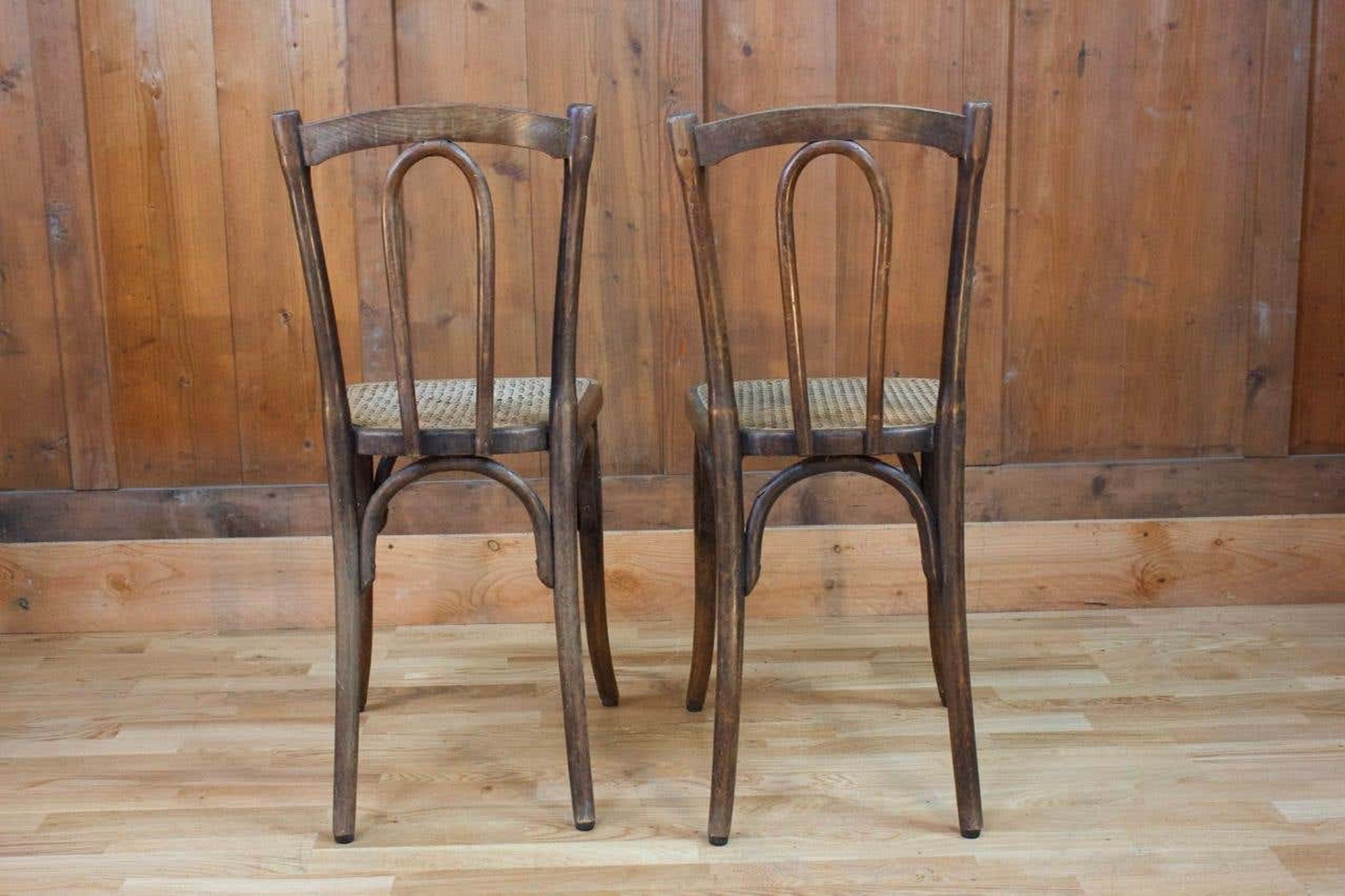 Pair of wooden bistro chairs, 20th century, France