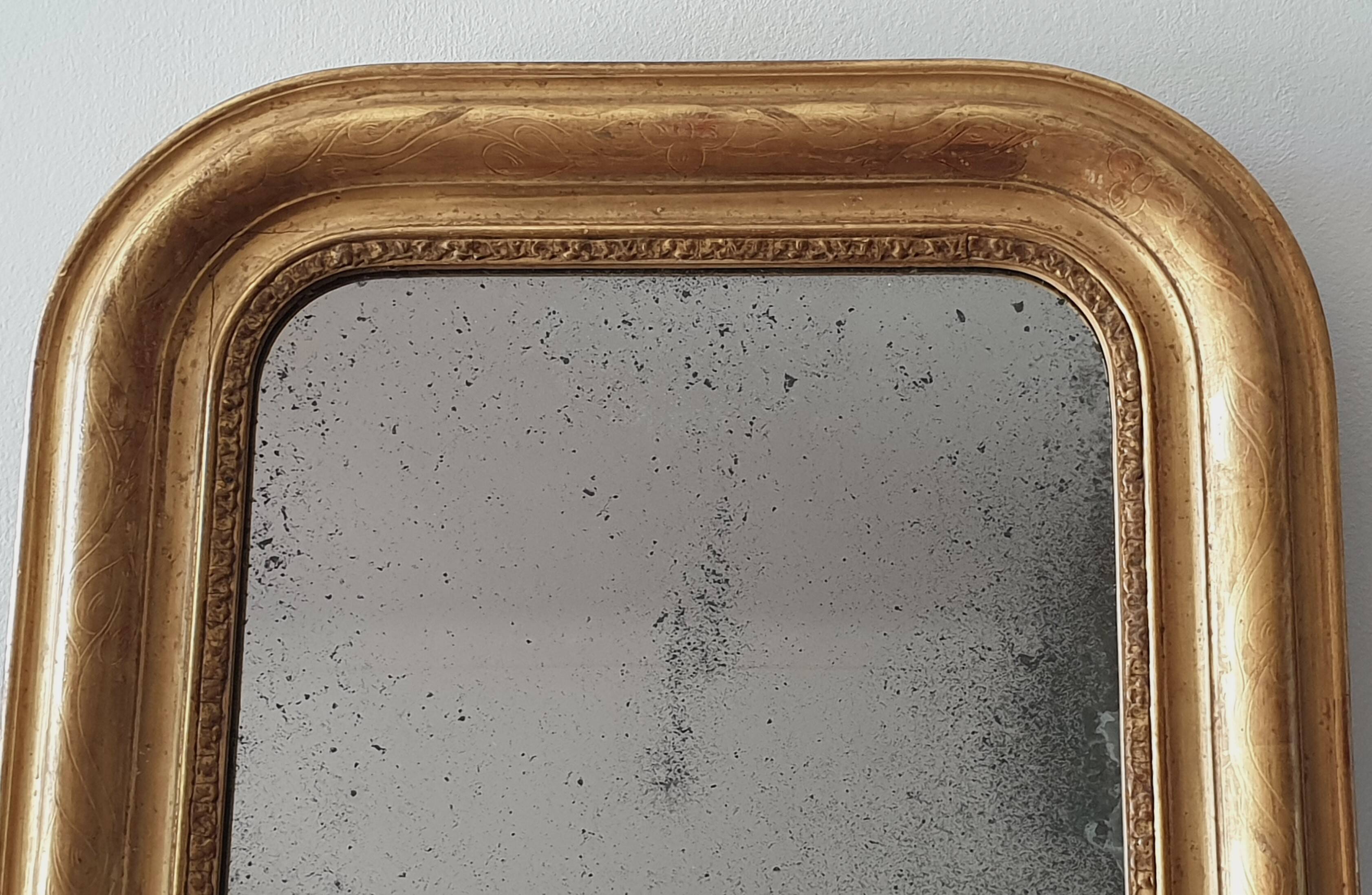 Old gilded mirror and old mercury glass - wall mirror with gold leaf