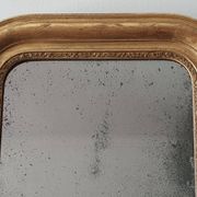 Old gilded mirror and old mercury glass - wall mirror with gold leaf