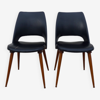 2 chairs in black skai compass legs Louis Paolozzi