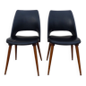 2 chaises en skaï noir pieds compas Louis Paolozzi