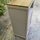 Beautiful art deco jam cupboard in delicate beige tone / and wicker basket