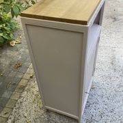 Beautiful art deco jam cupboard in delicate beige tone / and wicker basket
