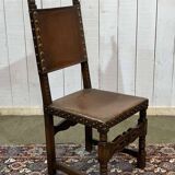 High-backed chair from the early 20th century in oak and leather