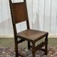 High-backed chair from the early 20th century in oak and leather