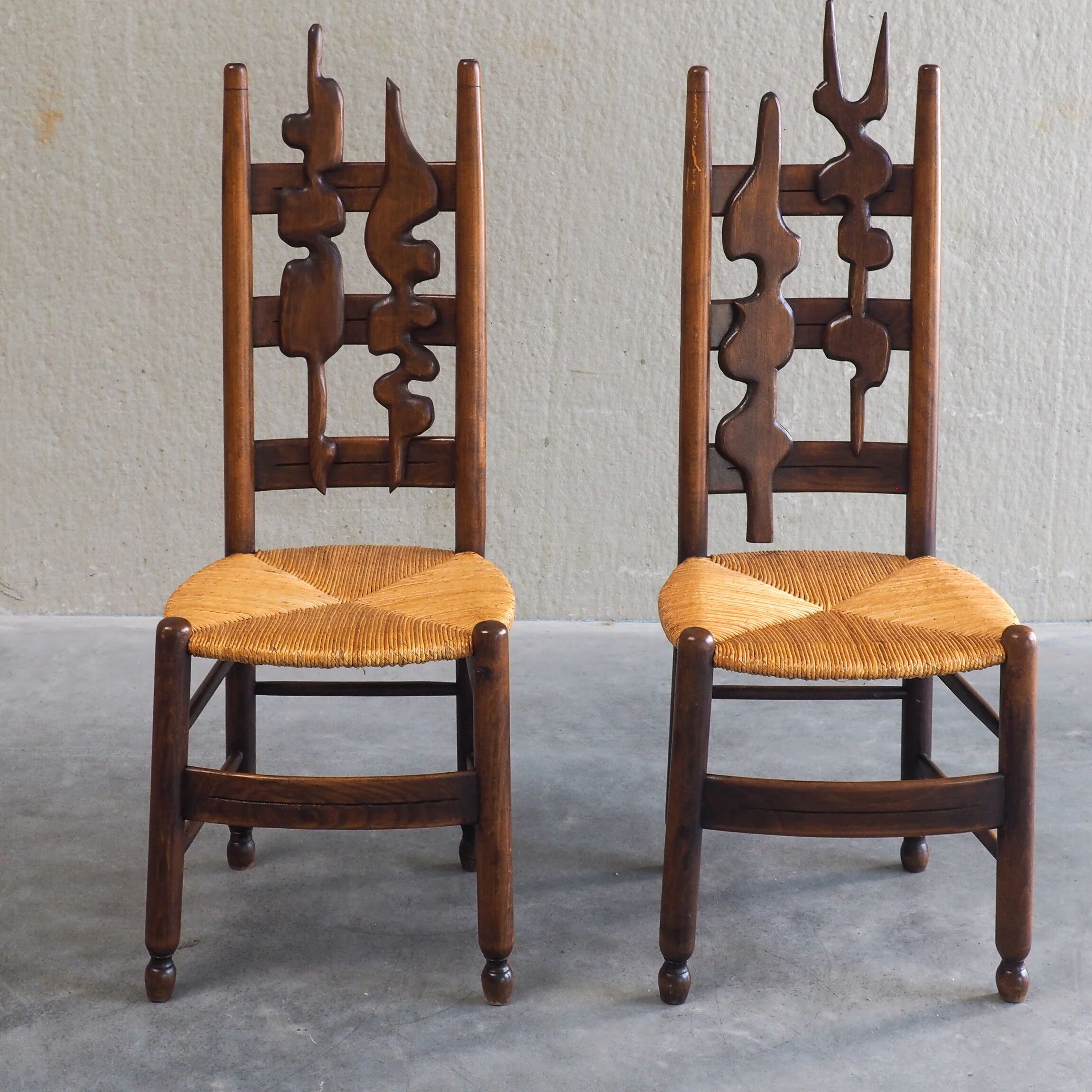 2 sculptural brutalist high-back chairs