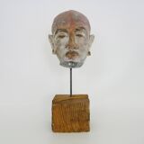 Face sculpture in polychrome earth and plaster, cabinet of curiosities. Ph Monaux. Ariège artist