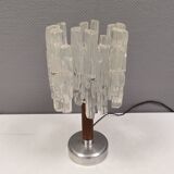 Table lamp with a teak ‘trunk’, silver-coloured metal base, acrylic shade