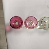 Set of 6 colored crystal stemmed glasses with gold twisted foot.