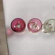 Set of 6 colored crystal stemmed glasses with gold twisted foot.