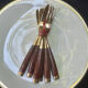 Wood and brass fish service