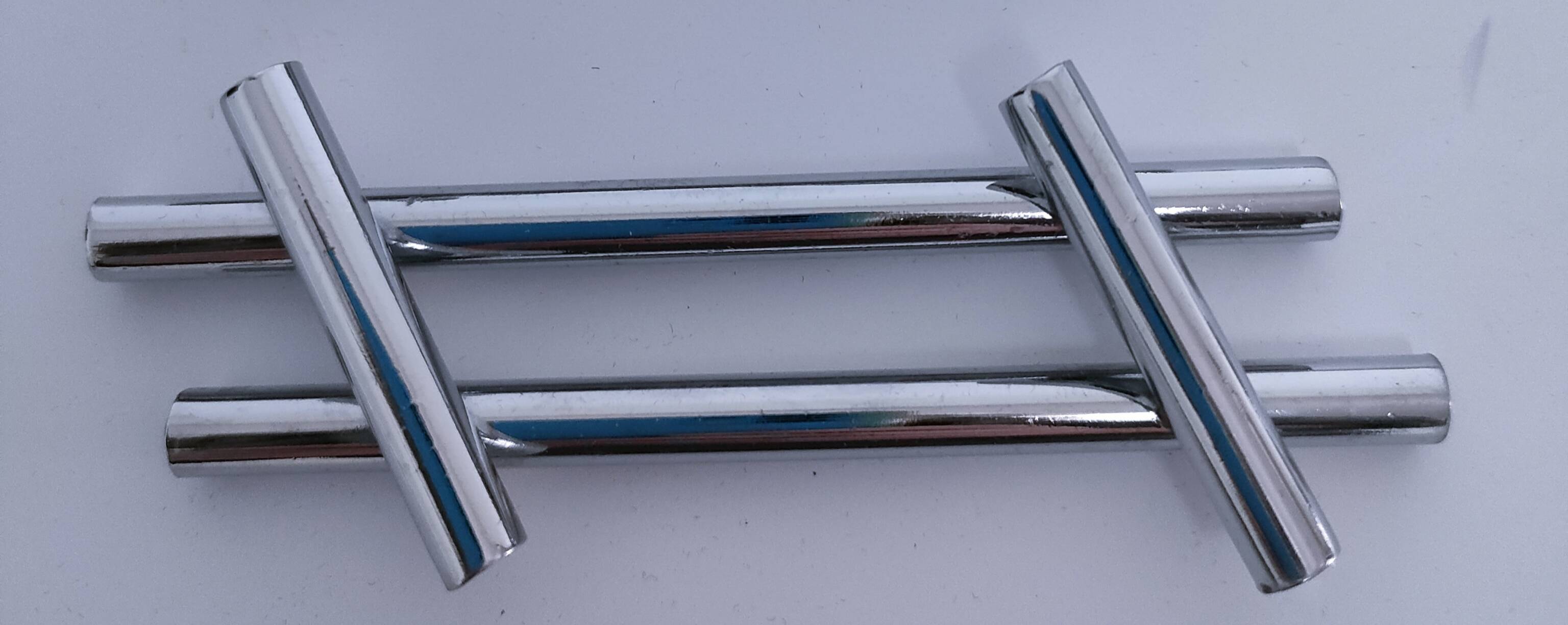 Twelve 70s design metal knife holders