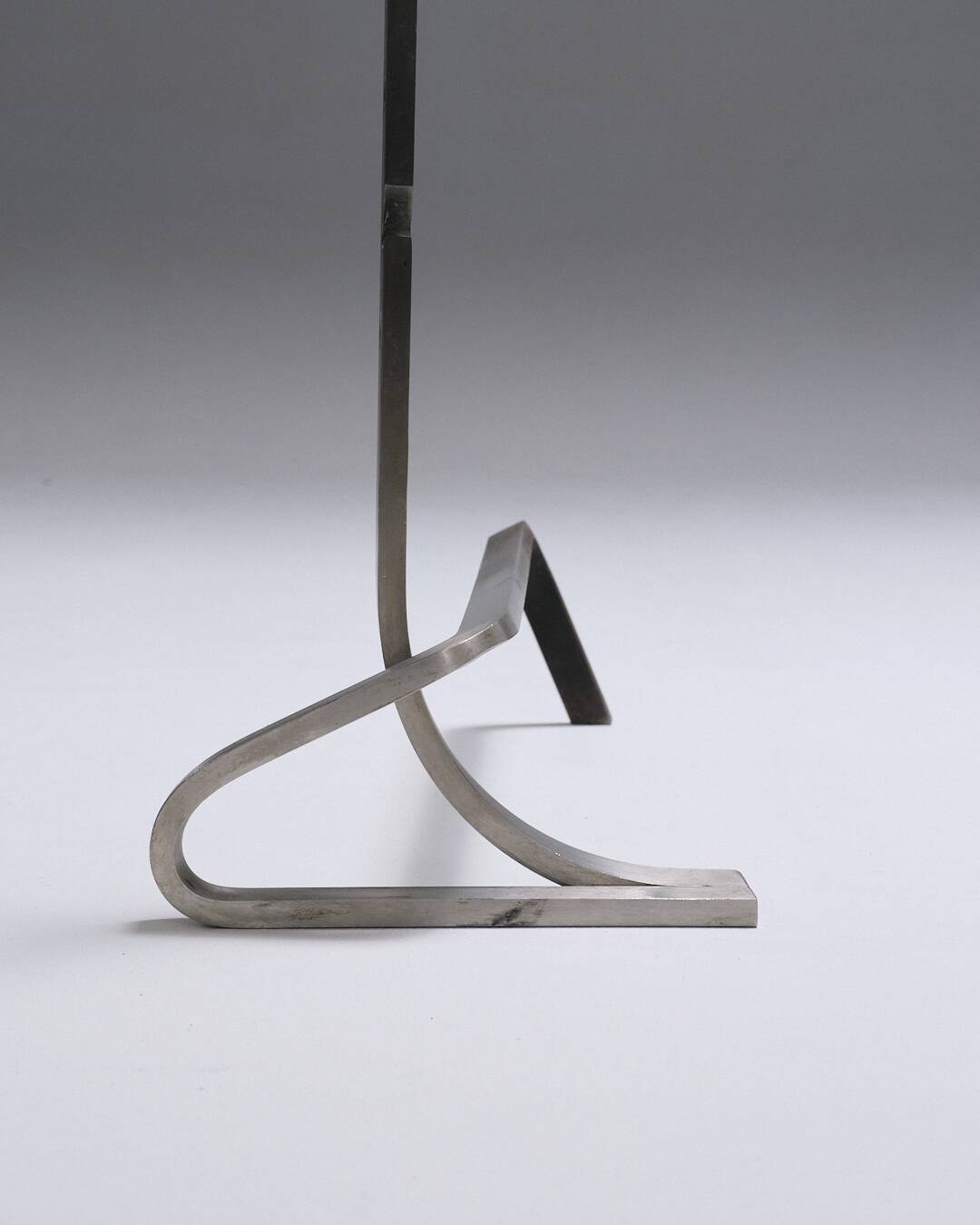 Pair of modernist brushed steel andirons, 1970s