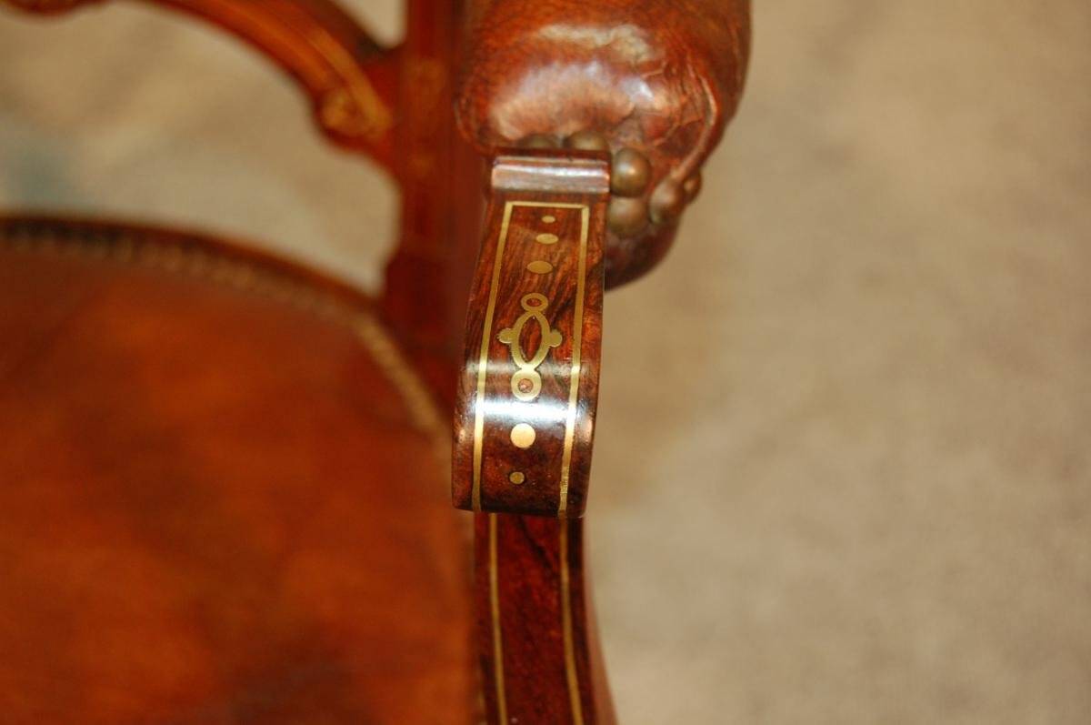 19th century armchair in leather and rosewood inlaid with brass and rosewood