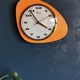 Vintage formica clock asymmetrical silent wall clock "Mervex orange"