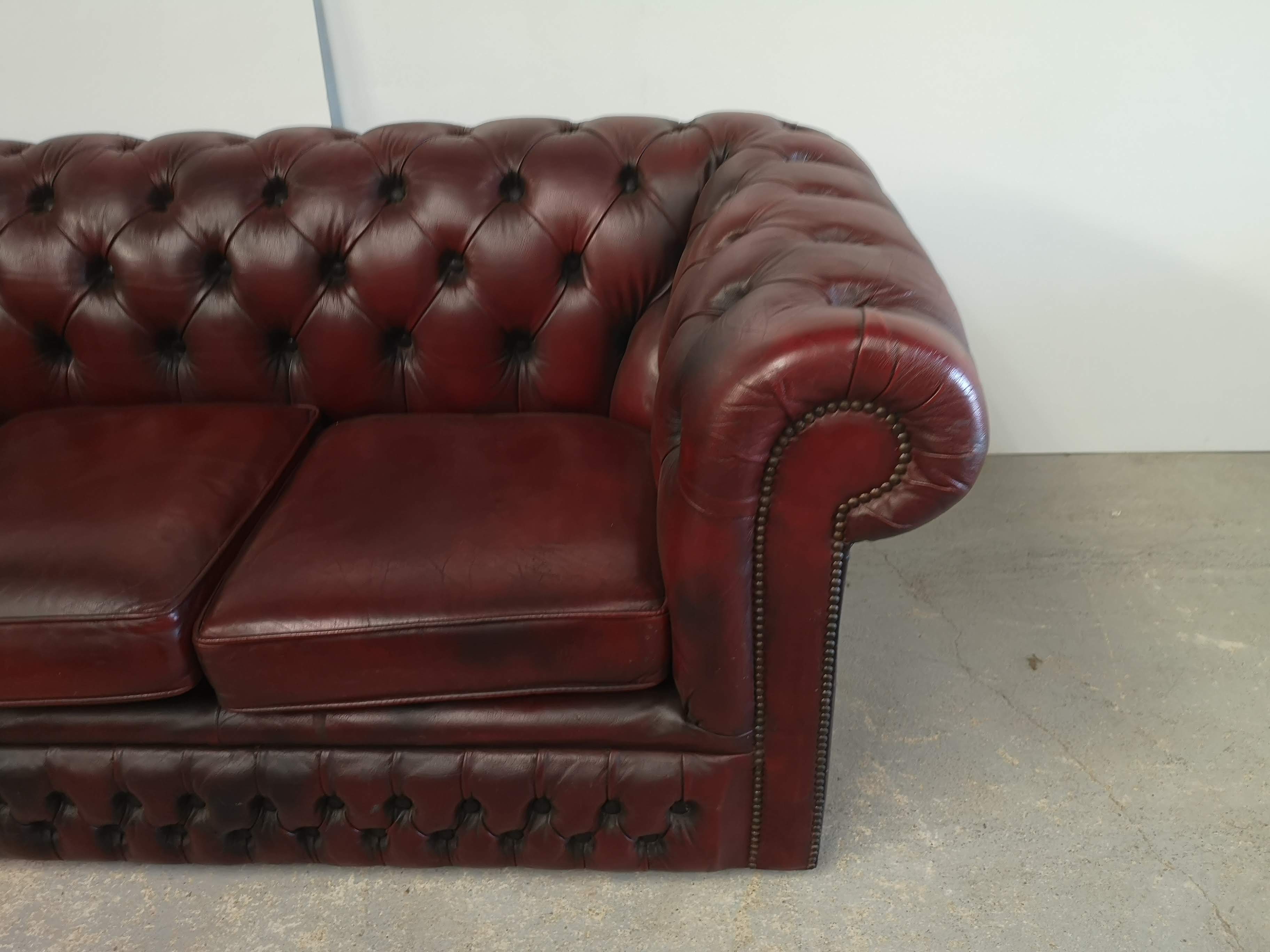 Burgundy leather chesterfield sofa