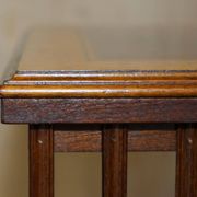Sheraton Revival rotating library table in walnut and satin wood.