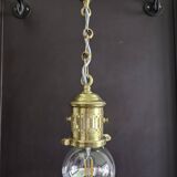 Brass pendant light with oversized LED bulb