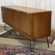 1970s English enfilade in teak with splayed legs.