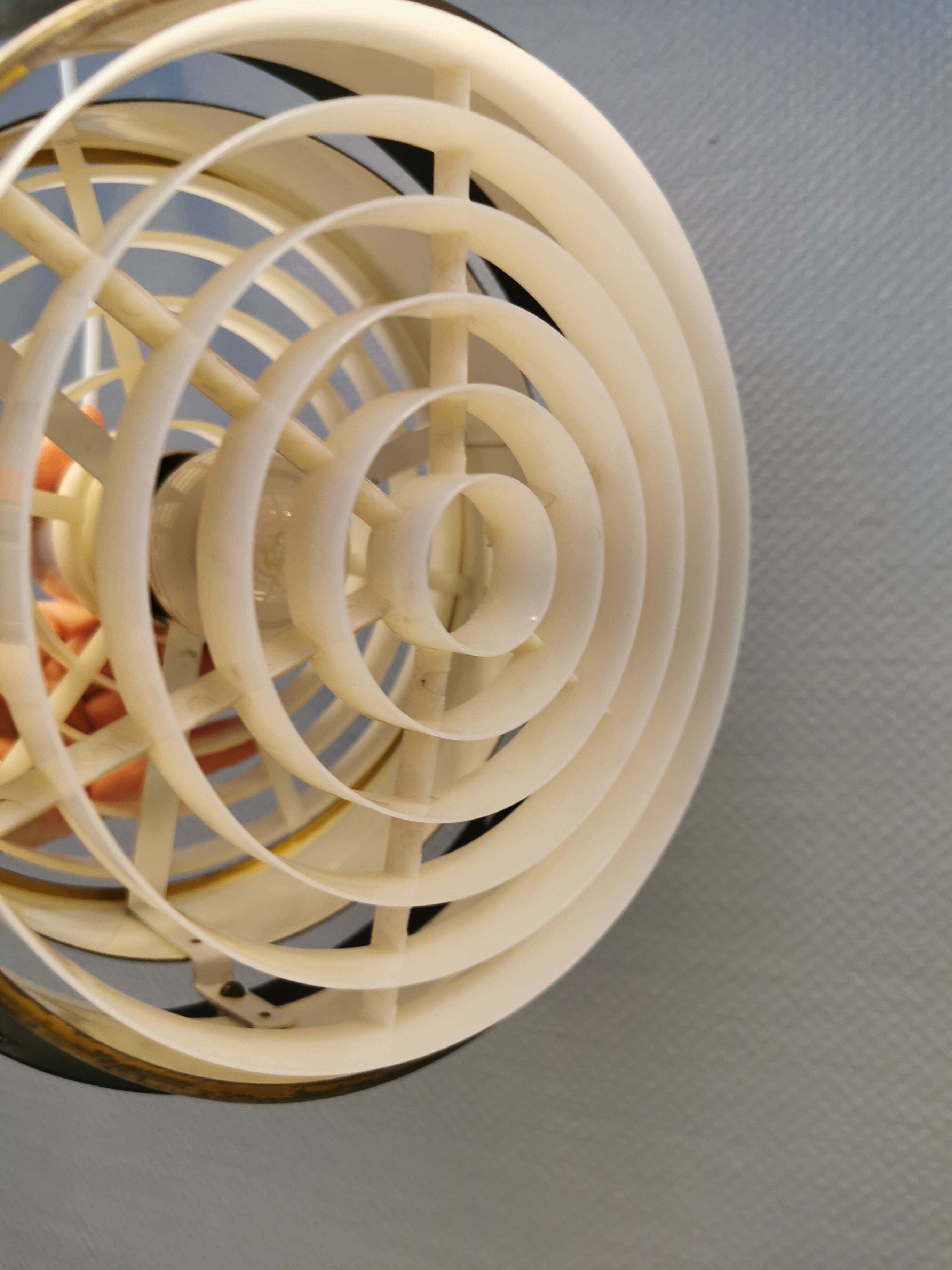 Metal hanging lamp with top and bottom grid of hard moulded plastic. Estimated 1970s.
