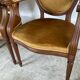 Paire de fauteuils médaillon en bois et velours