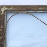 Gilded wooden frame and its glass