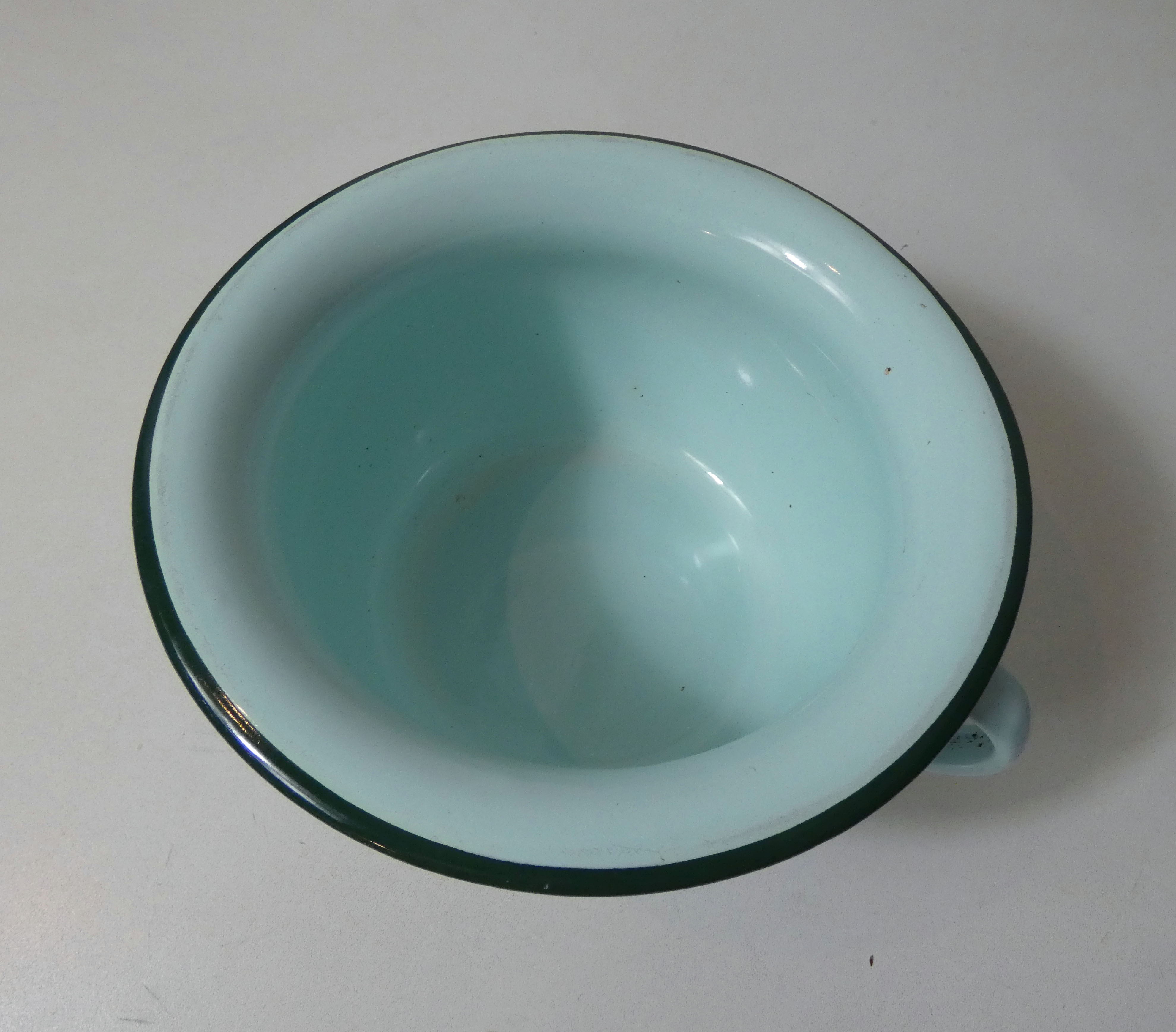 Old green enamelled steel pot cover