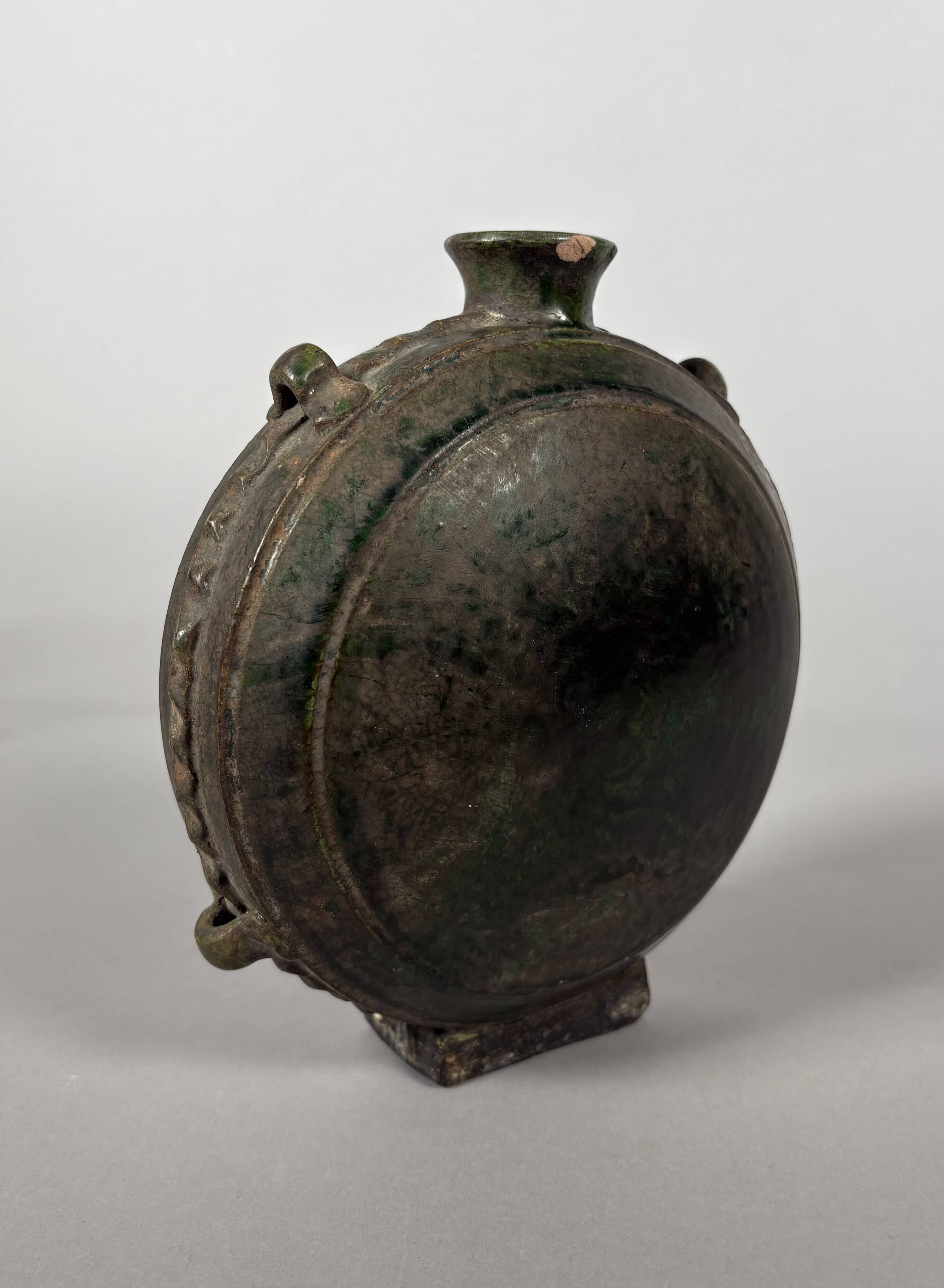 Nomadic rider's jug in green glazed earthenware, China, Tang Dynasty.