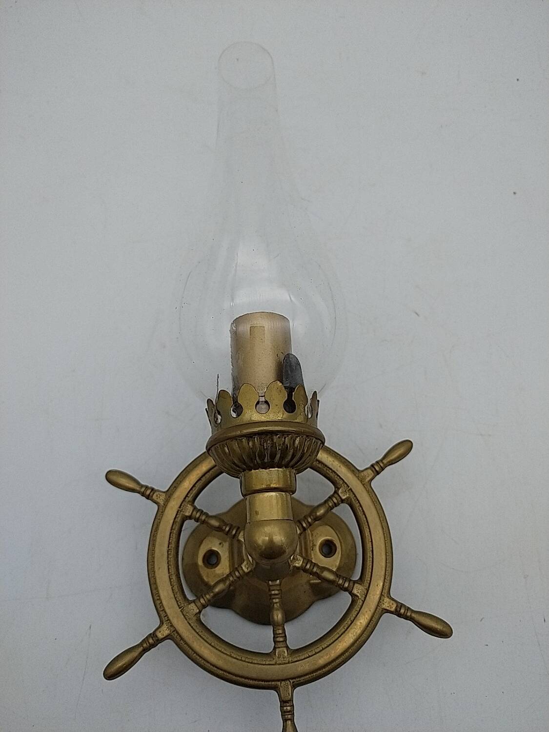 Brass wall sconces with nautical decor