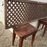 Headboard and its two wooden bedside tables.