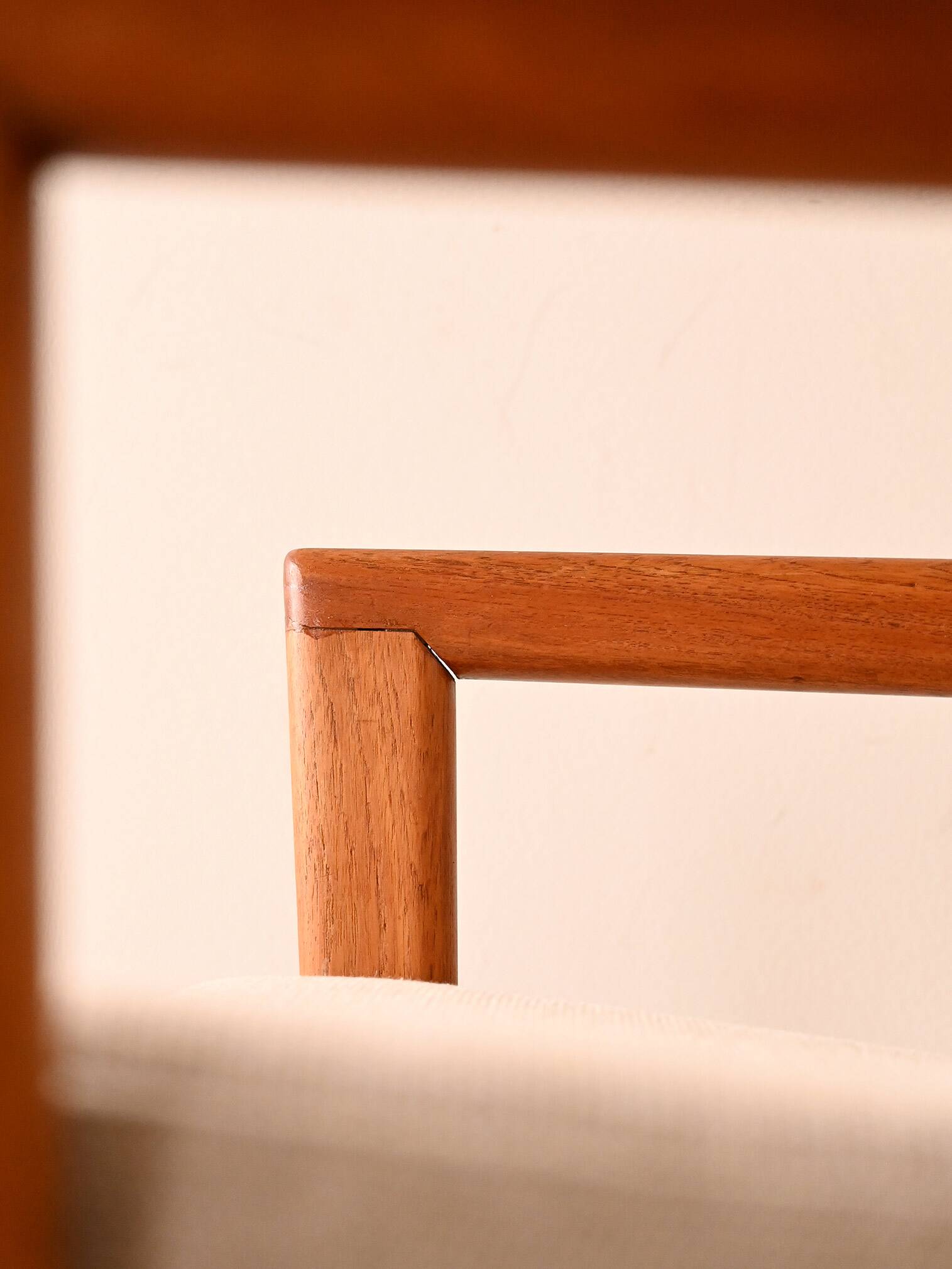 Upholstered armchair with teak frame