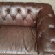 Three seater brown leather chesterfield sofa