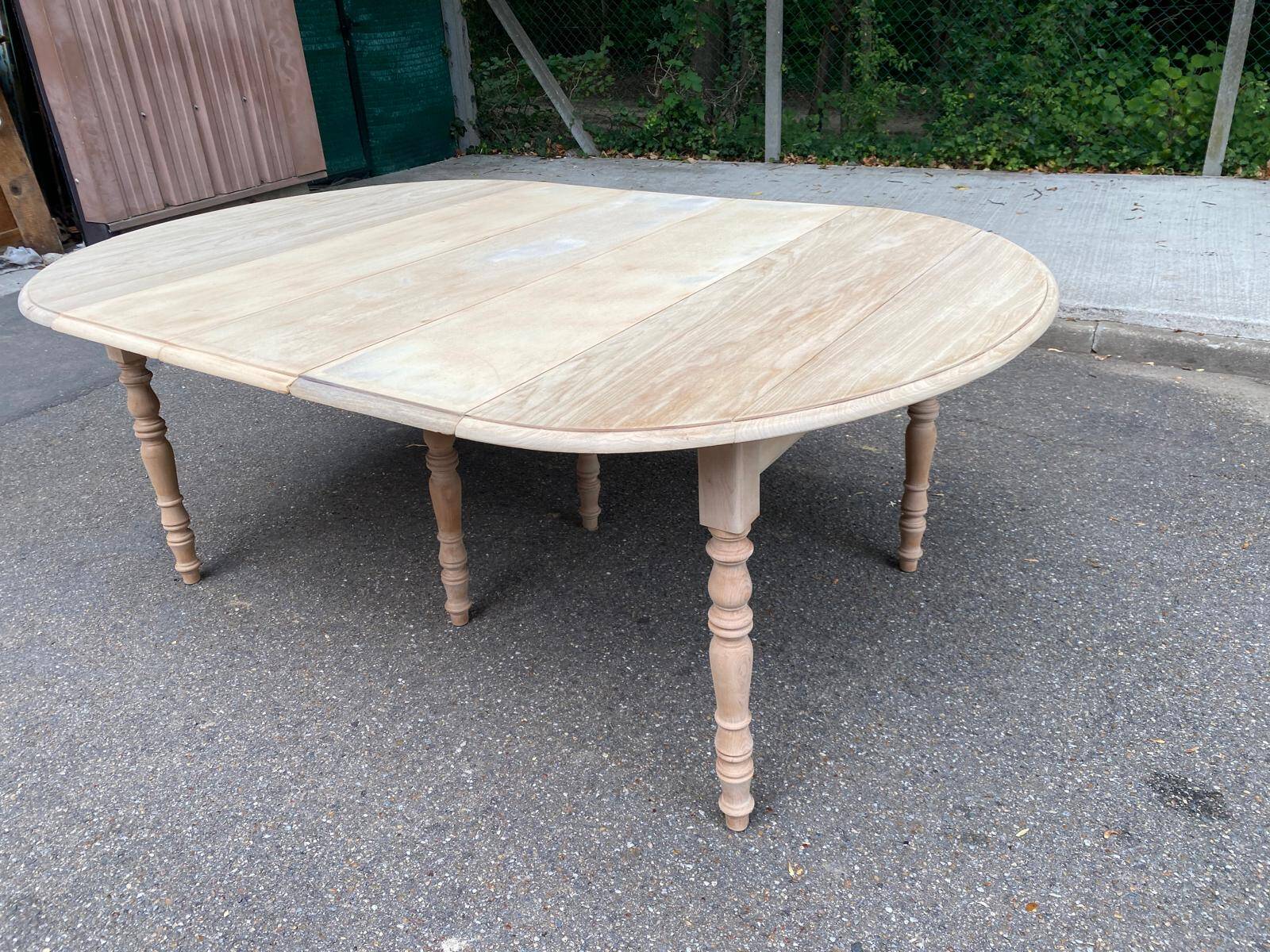 Renovated Louis Philippe round extendable dining table with flaps and 3 extensions.