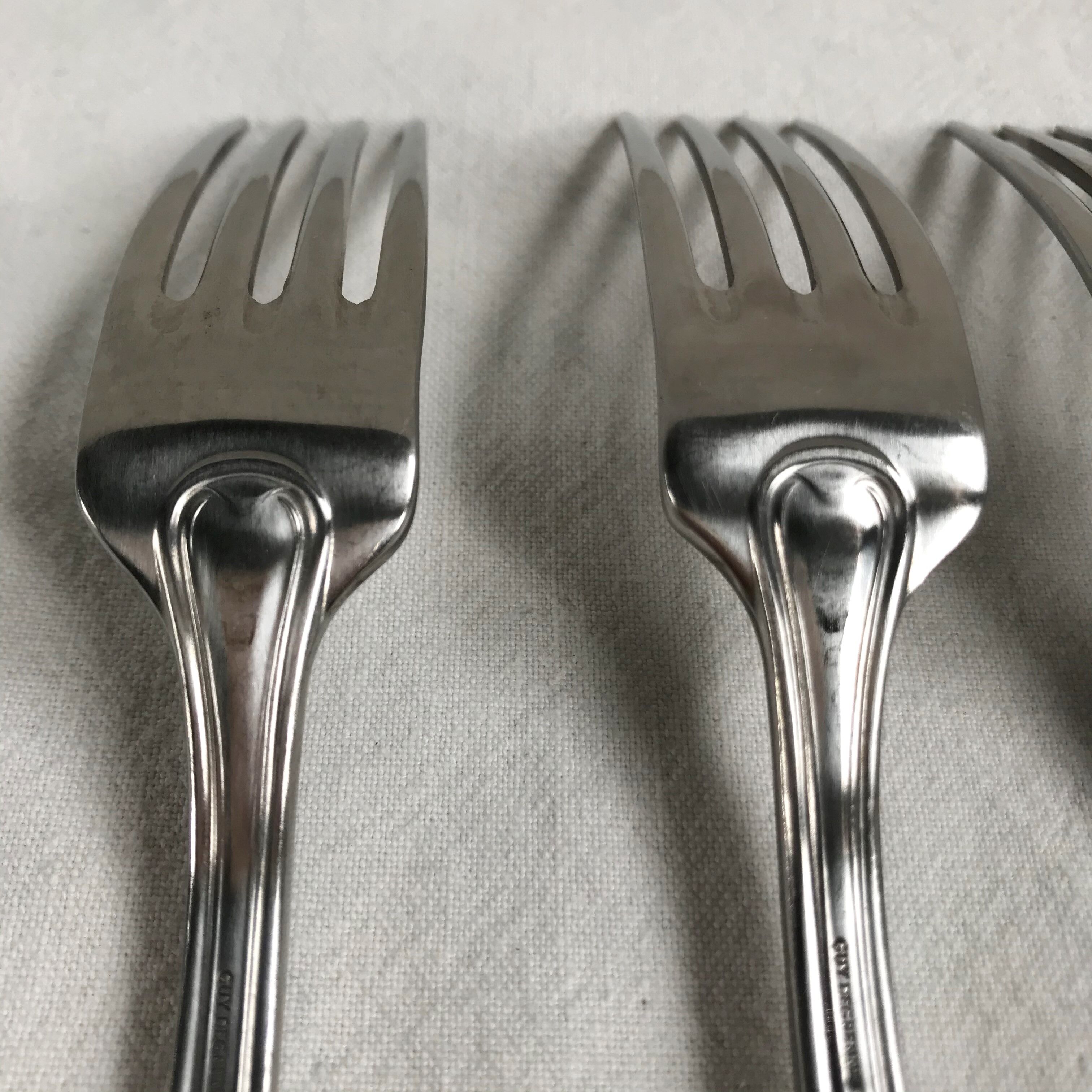 Eleven Guy Degrenne forks in silver metal