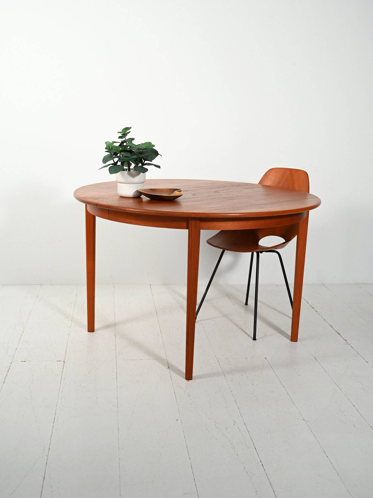 Round extendable teak table by Svante Skogh