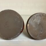 Pair of red vases in the shape of an elephant's foot