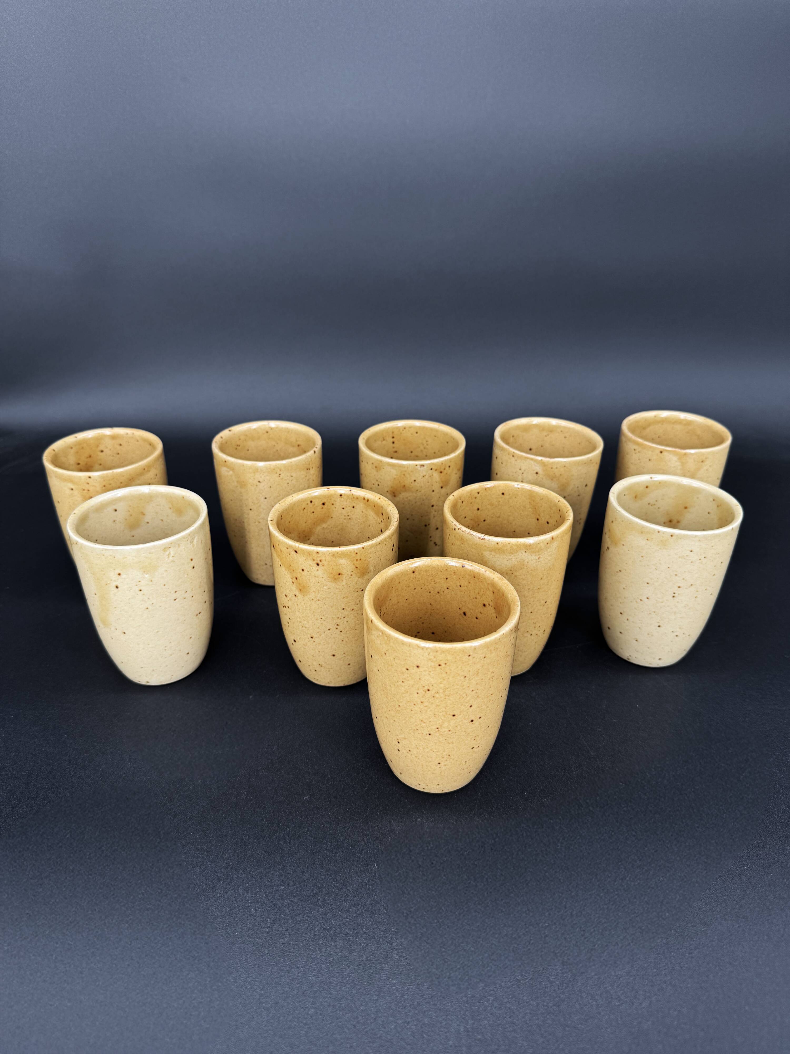 10 glazed stoneware cups signed Digoin