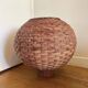 Large vintage lampshade made of hand-woven rattan.