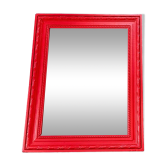 The red wooden mirror.