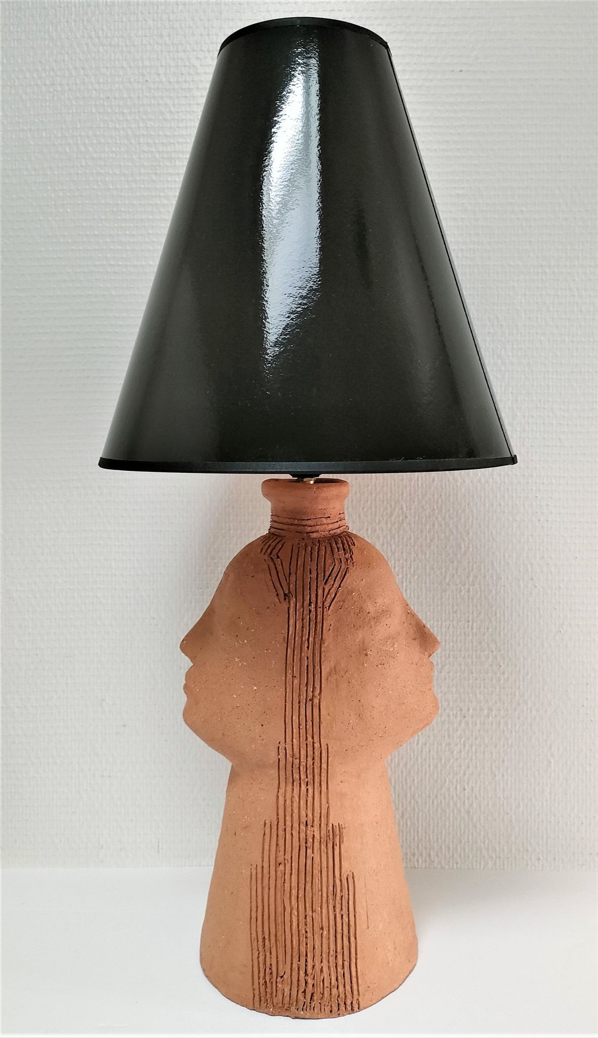 Anthropomorphic lamp foot depicting two faces terracotta design 80s