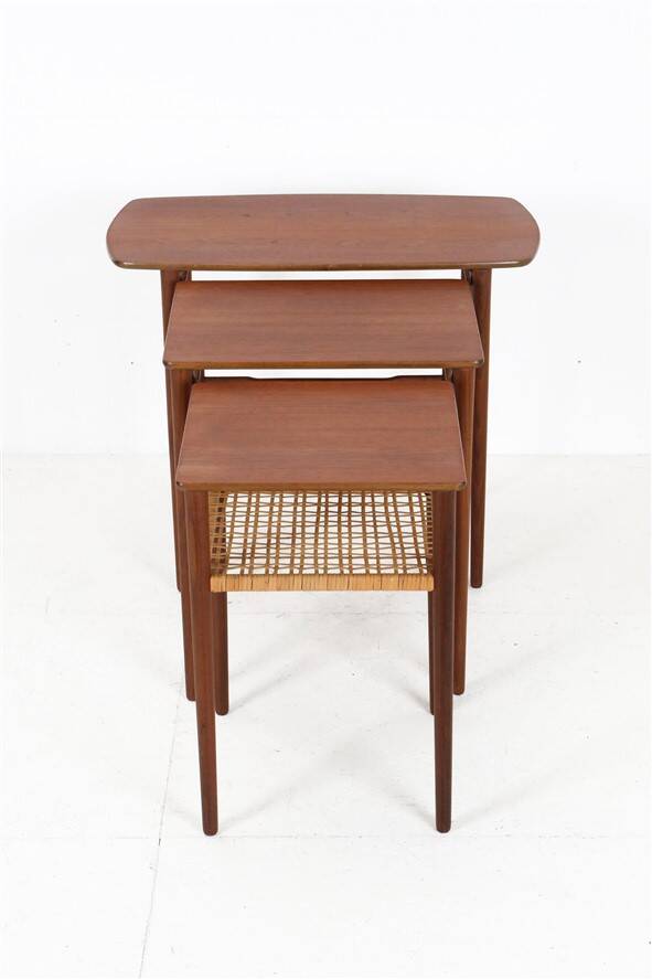Rare set of three teak nesting tables with cane magazine rack / side tables / mid-century Danish modern design / 1950s / 1960s