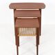 Rare set of three teak nesting tables with cane magazine rack / side tables / mid-century Danish modern design / 1950s / 1960s