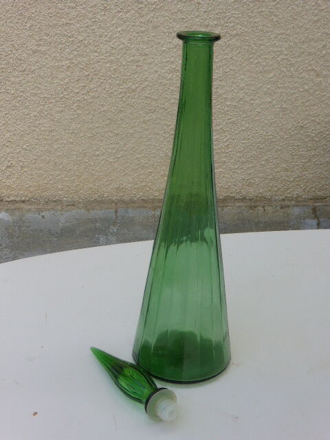 Vintage green faceted glass bottle with its cap 1970