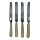 Set of 4 dessert knives with rounded blades and smooth ivory resin handles.