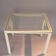 White lacquered side table by Pierre Vandel with gold brass.