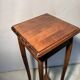 Vintage dark wood side table with curved base