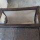 Relaxed armchair in bamboo and rattan with its small side table. Beige linen cushion.